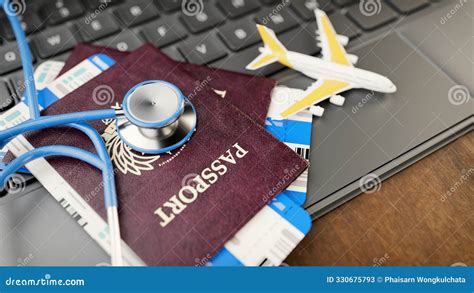 A Stethoscope On Passports Boarding Passes And A Miniature Airplane A Stethoscope On Passports Boarding Passes And A Miniature Airplane