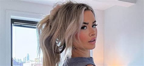 Emily Elizabeth Flaunts Underboob In This Poolside Bikini Video