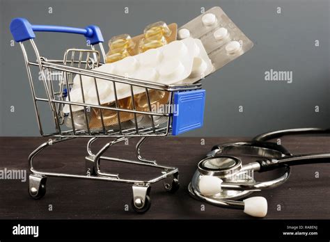 Medical Insurance Shopping Cart With Medicines And Stethoscope Stock Medical Insurance Shopping Cart With Medicines And Stethoscope Stock